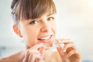 Teen wearing Invisalign aligners 